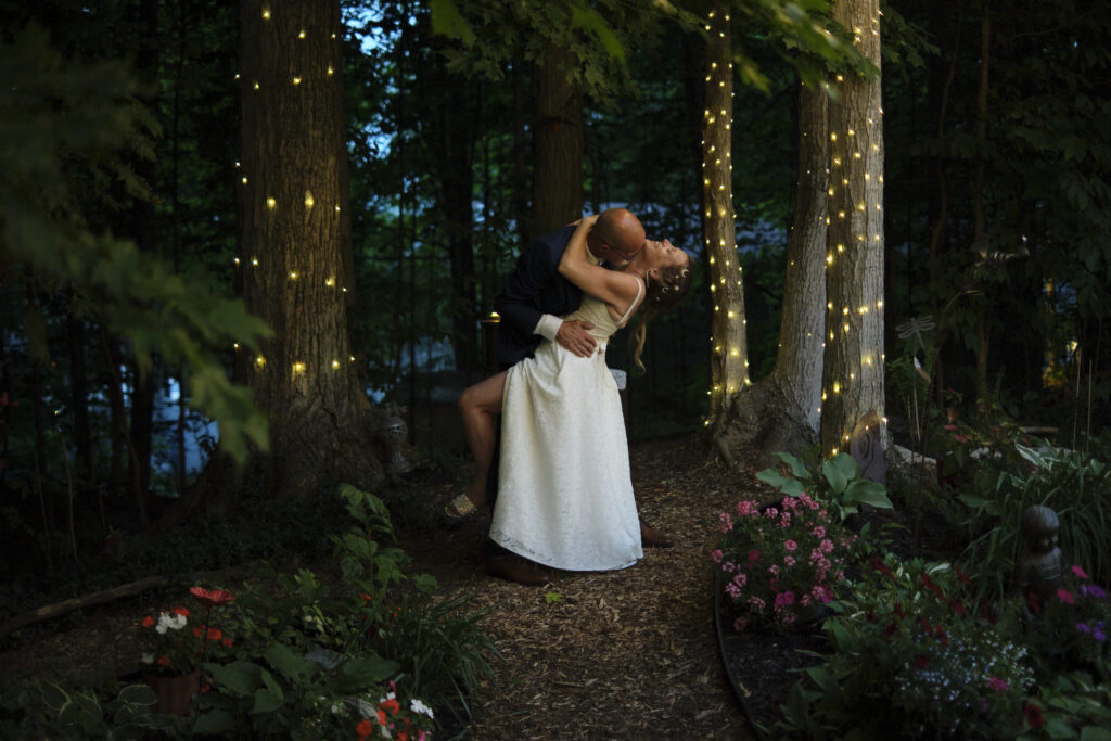 Bride and groom enjoying a private moment when the groom surprised the bride with a dop and a kiss. - capturing the beauty of candid wedding moments."