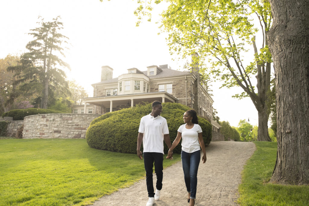 A walk on the grounds of  a historic mansion engagement session in Ontario