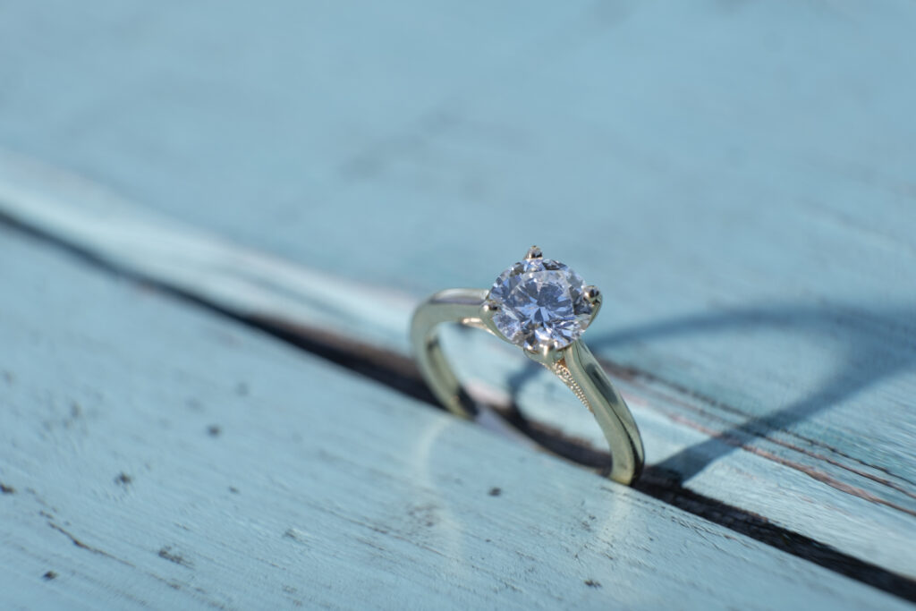 A ring is displayed in a table in a Collingwood Ontario Engagement Session.