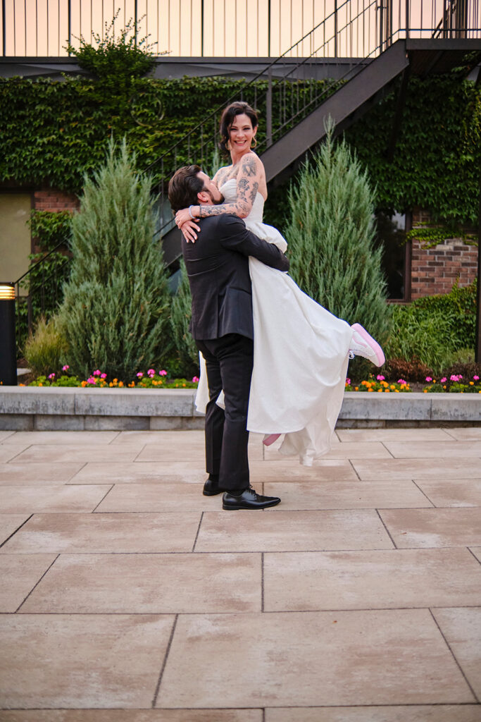 Bride and Groom enjoying a moment on the patio during their reception at Nottawasaga Inn Resort & Conference Centre during their wedding day in Alliston, Ontario.