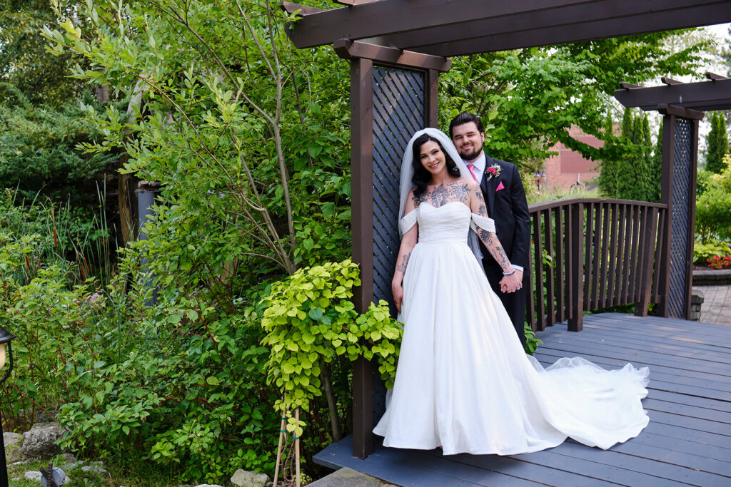 Couple in the wedding garden at Nottawasaga Inn Resort & Conference Centre during their wedding day in Alliston, Ontario.