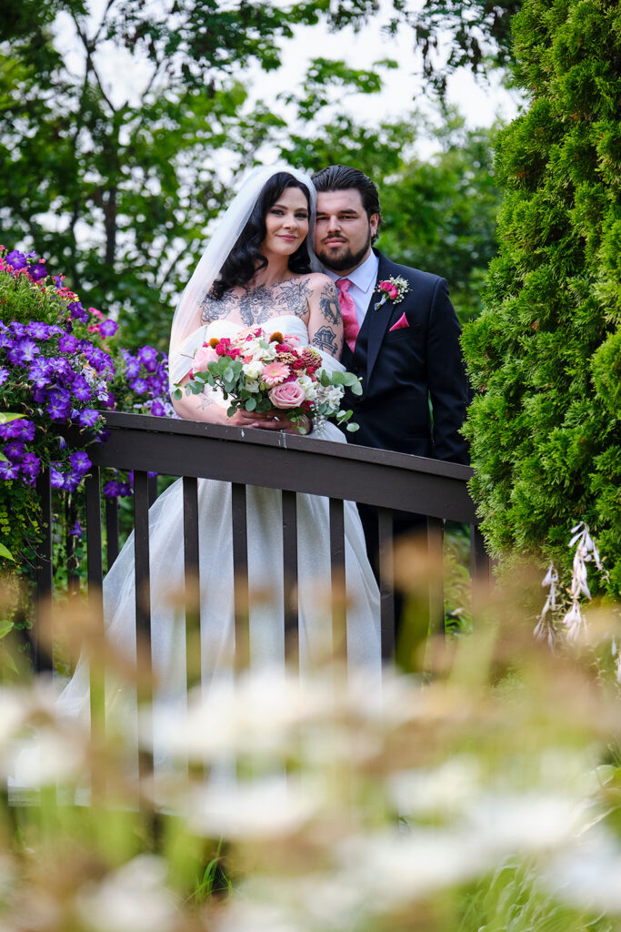 Couple in the wedding garden at their summer wedding at Nottawasaga Inn Resort & Conference Centre during their wedding day in Alliston, Ontario.